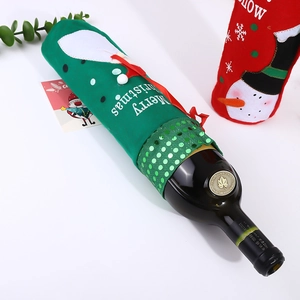 Detail of green felt Christmas wine bottle cover with sequins and Merry Christmas text