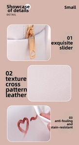 Detail of pink PU leather makeup bag with heart-shaped zipper and stain-resistant texture