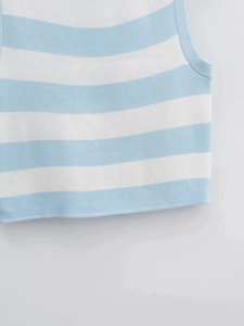 Macro shot of blue and white striped knitted vest showing side stitching and texture