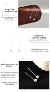 Vue détaillée des boucles d'oreilles traversantes en argent S925 et perles blanches