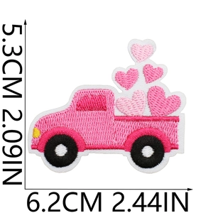 Detail of pink truck embroidery patch with hearts and measurement scale markers