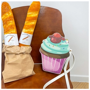 Detailed view of creative cupcake crossbody bag with colorful PU leather and strawberry decor