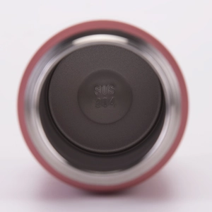 Detail view of pink insulated bottle interior showing the SUS 304 stainless steel bottom mark
