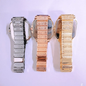Detailed back view of diamond-studded metal watch straps in silver, rose gold and gold
