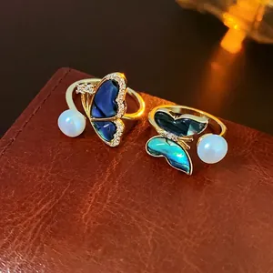 Elegant gold plated butterfly ring with shell inlay and freshwater pearl detail