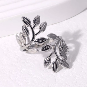 Macro shot of polished stainless steel leaf ring with dual branch adjustable design