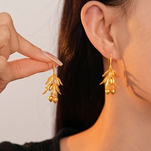 Vintage matte gold plated leaf and flower hook earrings with textured metallic finish