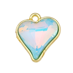 Macro shot of gold-plated heart pendant featuring a multi-color iridescent glass gem