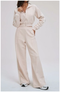 Close-up of color-block sports pants with side stripes and vertical seam texture