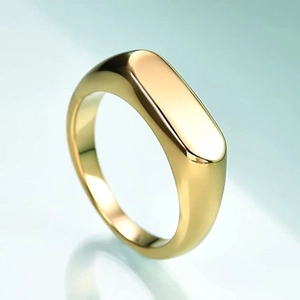 Macro shot of minimalist gold polished rectangular bar signet ring with mirror finish