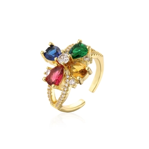 Detailed view of gold plated adjustable ring with multicolor zircon stones in water drop shapes