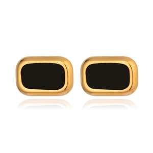 Macro detail of rectangle cufflinks with gold metallic frame and black inlay