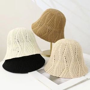 Knitted hollow fisherman bucket hats in khaki, white, black and beige on display