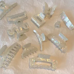 Pearlescent white acetic acid hair claw set with butterfly and wave designs