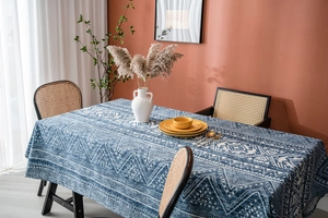 Detail of blue geometric tribal pattern on linen rectangle tablecloth for dining