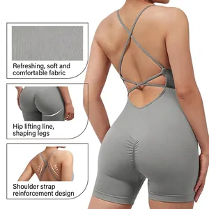 Gray backless one-piece yoga bodysuit with cross straps and ruched butt-lifting detail