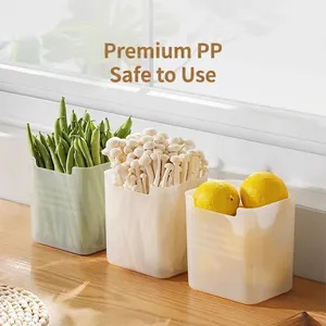 Three-piece semi-transparent PP refrigerator side door organizer boxes on wooden surface