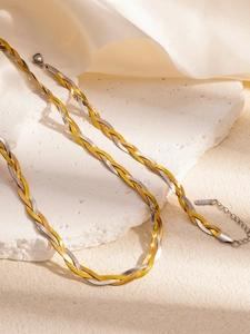 Detail of two-tone braided snake chain necklace with lobster clasp and extension chain