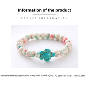 Detailed macro of wooden beads bracelet with blue turtle charm and ethnic ink textures
