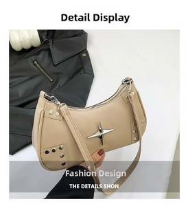 Detail view of beige square bag with silver star hardware and metal rivet trim
