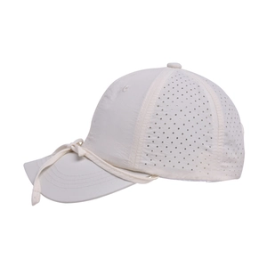 Detail view of quick-dry baseball cap with laser-cut ventilation holes and bow tie accent