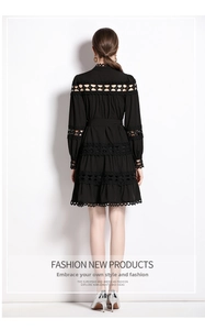 Back view of Victorian style dress featuring lace cutouts and tiered ruffle hemline