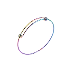 Detail of iridescent 1.8mm stainless steel coil bracelet with adjustable sliding clasp design