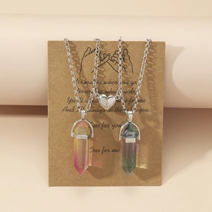 Detail of magnetic heart pendants with hexagonal crystals on romantic poem display card