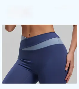 Detail of high-waisted yoga shorts with blue contrast panels and soft elastic fabric