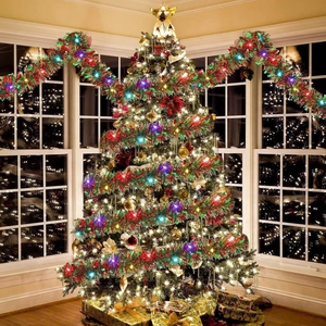 Christmas tree decorated with colorful LED ribbon lights and festive tinsel garlands