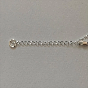 Detail of S925 sterling silver lobster clasp and extension chain with purity hallmark