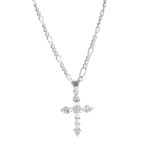Macro view of polished silver Figaro chain and cross pendant with inlaid clear zircons