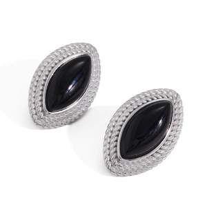 Detail of vintage marquise black enamel stud earrings with silver rope textured borders
