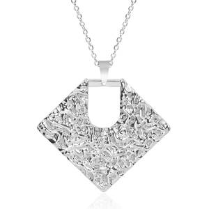 Detailed view of silver square metal pendant with irregular texture and high-gloss finish