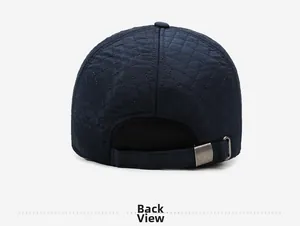 Rear view of navy quilted baseball cap showing adjustable strap and metal buckle detail