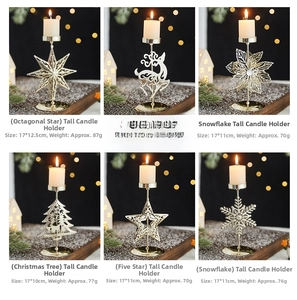 Detailed view of 17cm gold metal Christmas candle holders in various festive shapes