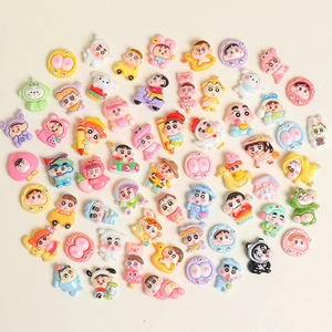 Flat lay of colorful Crayon Shin-chan resin charms and figurines for DIY crafts
