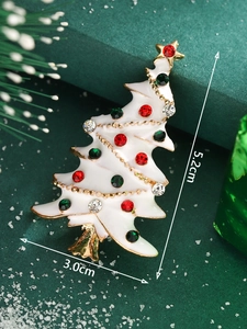 Detailed view of a white Christmas tree brooch with colorful rhinestones, 5.2cm height