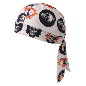 Detail of white cycling bandana featuring skull and flame print with adjustable ties