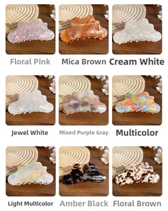 Macro display of nine acetate cloud hair claws in various elegant marble patterns