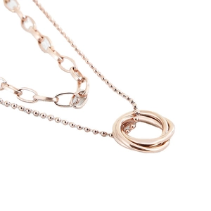 Elegant rose gold layered necklace featuring a triple interlocking circular pendant design