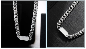 Detail view of silver stainless steel Cuban chain necklace with smooth rectangular pendant
