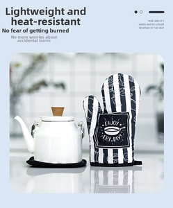 Detailed view of striped heat resistant oven mitt with Enjoy Fry Days slogan and kettle