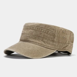 Close-up of khaki washed canvas cadet cap showing metal eyelets and reinforced stitching