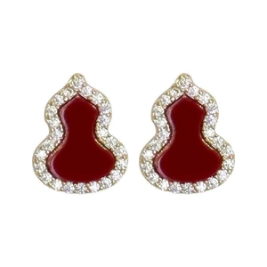 Elegant gold plated gourd stud earrings with red core and white zircon stones on white background