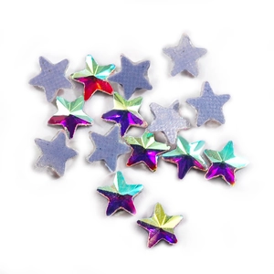 Macro shot of K9 AB crystal stars and matte purple grey rhinestones for DIY nail art