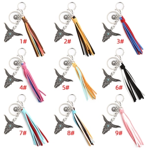 Detailed grid of bohemian bull head keychains with multi-colored suede tassels and beads