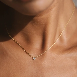 Minimalist S925 silver gold-plated chain necklace with a single round zircon pendant