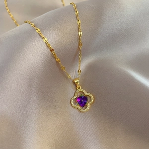 Titanium steel four-leaf flower necklace with purple gemstone on champagne silk
