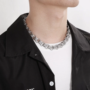 Model wearing a 15mm chunky stainless steel curb chain necklace in silver finish